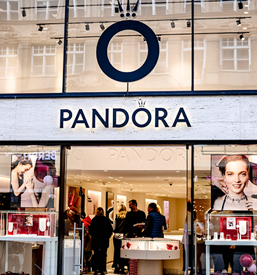 Photo of a Pandora store with customers